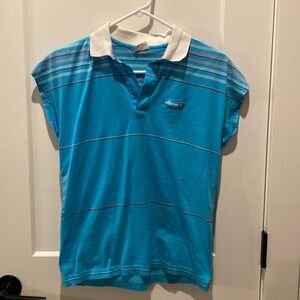 Ellesse Ladies Sleeveless Tennis Shirt.  Size 12.  Blue.  Pit to‎ pit is 17”